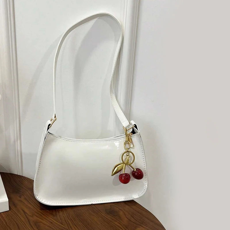 Women's PU Leather Handbag Versatile Fashion Solid Color Cherry Pendant Shoulder Bag Casual Commuting Bag Girl Underarm Bag